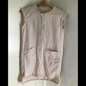 Denim material off white in color. Zipper down the front